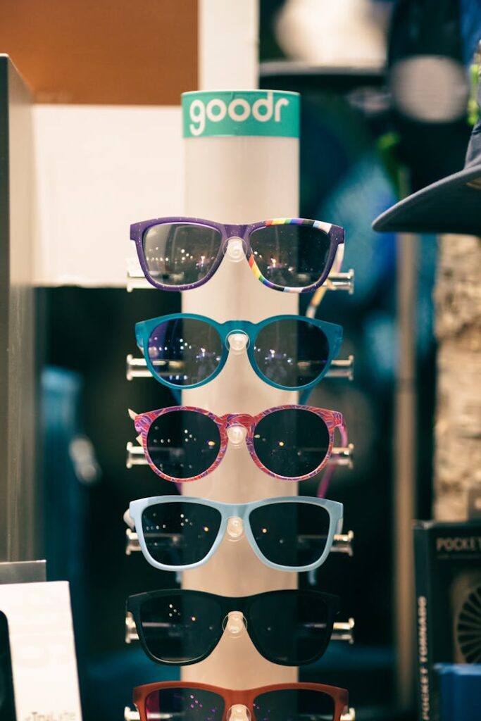 Colorful arrangement of sunglasses on a retail display, showcasing various stylish eyewear.